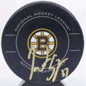 Patrice Bergeron Autographed Bruins game puck   Autographed NHL Pucks
