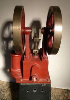 This auction is for a large vintage vertical steam engine.It looks in 