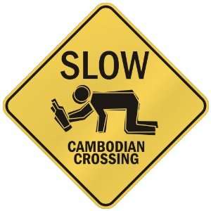   SLOW : CAMBODIAN CROSSING  CAMBODIA: Home Improvement