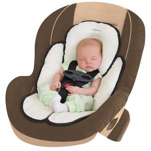 Adorable baby asleep in a comfortable infant car seat