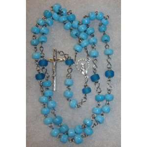   with blue glass beads. It is a piece of handmade art. 