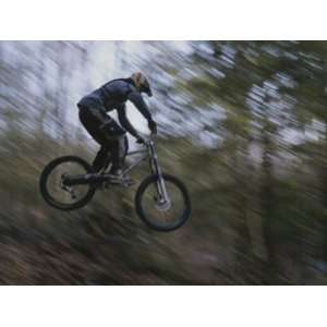  A Boy Flies Through the Air on His Mountain Bike Stretched 