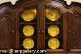 Hand carved of walnut about 1930, this grand curio, china cabinet or 