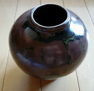 vintage pottery, modern dark black pot with modern brown and green 